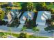 Beautiful aerial view of charming single-story homes with well-manicured lawns and mature palm trees at 2511 Lantana Ln, Palmetto, FL 34221