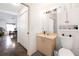 Bathroom with light beige vanity, toilet, and view into adjacent bathroom at 2511 Lantana Ln, Palmetto, FL 34221