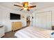 Serene bedroom features modern ceiling fan, spacious closet and a neutral color palette at 2511 Lantana Ln, Palmetto, FL 34221