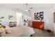 Sunlit bedroom featuring a neutral color palette, polished concrete floors, and modern ceiling fan at 2511 Lantana Ln, Palmetto, FL 34221