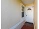Inviting front entrance with a well-maintained walkway, new doormat and freshly painted door at 2511 Lantana Ln, Palmetto, FL 34221