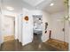 Bright foyer with polished concrete and tile floors leading to a bedroom and the rest of the house at 2511 Lantana Ln, Palmetto, FL 34221