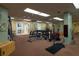 Well-equipped gym featuring free weights, weight machines, and mirrors for a comprehensive workout experience at 2511 Lantana Ln, Palmetto, FL 34221
