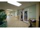 Inviting hallway leading to exercise room with palm tree decor and information about Zipsweat fitness at 2511 Lantana Ln, Palmetto, FL 34221