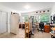 Well-lit home office with dual workstations, ample storage, and large windows overlooking the backyard at 2511 Lantana Ln, Palmetto, FL 34221