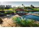 Relaxing pool area with outdoor bar, seating, and lush landscaping, perfect for leisure and entertainment at 2511 Lantana Ln, Palmetto, FL 34221