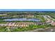 Community aerial view shows serene lakes, lush trees, and beautiful homes in a neighborhood at 2525 Daisy Dr, North Port, FL 34289