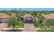 Beautiful single-Gathering home featuring mature landscaping, a tile roof, and a two-car garage at 2525 Daisy Dr, North Port, FL 34289
