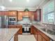 Well-equipped kitchen with stainless steel appliances, granite countertops, and a neutral backsplash at 2525 Daisy Dr, North Port, FL 34289