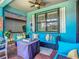 Inviting covered patio with cozy seating, stylish decor, and a relaxing ambiance for outdoor enjoyment at 2525 Daisy Dr, North Port, FL 34289