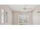 Bedroom with plantation shutters, neutral paint, and a ceiling fan at 25433 Colon Dr, Punta Gorda, FL 33983