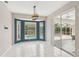 Dining room with a bay window overlooking a pool and sliding glass door at 25433 Colon Dr, Punta Gorda, FL 33983