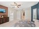 Tranquil main bedroom with a navy wall, plantation shutters, and a view into the attached bathroom at 25433 Colon Dr, Punta Gorda, FL 33983