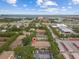Aerial view of multi-Gathering residential community with mature trees and lush landscaping at 2553 Harn Blvd # 1, Clearwater, FL 33764