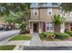 Inviting two-story townhome featuring manicured landscaping and covered front porch at 2553 Harn Blvd # 1, Clearwater, FL 33764