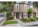 Charming two-story townhome featuring landscaped yard and inviting front entry at 2553 Harn Blvd # 1, Clearwater, FL 33764