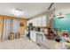 Bright kitchen with tile floors, stainless steel appliances, and granite countertops at 2553 Harn Blvd # 1, Clearwater, FL 33764
