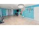 Spacious living room featuring tile floors and staircase at 2553 Harn Blvd # 1, Clearwater, FL 33764
