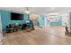 Open-concept living space with wood floors, tile floors, and a staircase at 2553 Harn Blvd # 1, Clearwater, FL 33764