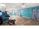 Bright, open living space with wood and tile flooring with chandelier lighting at 2553 Harn Blvd # 1, Clearwater, FL 33764