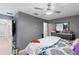 Main bedroom with ceiling fan and dresser, offers comfortable living space at 2553 Harn Blvd # 1, Clearwater, FL 33764