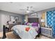 Main bedroom features a ceiling fan, decorative curtains and furniture at 2553 Harn Blvd # 1, Clearwater, FL 33764