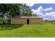 Exterior view of barn, set in green grass, for rural setting at 26147 L And J Rd, Myakka City, FL 34251