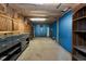 Spacious unfinished basement featuring concrete floors, shelving, storage cabinets, and exposed ceiling at 26147 L And J Rd, Myakka City, FL 34251
