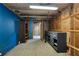 Unfinished basement with shelving, cabinetry, and concrete floors offering potential for customization at 26147 L And J Rd, Myakka City, FL 34251