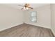 Bedroom featuring a ceiling fan, a window with blinds and wood look flooring at 26147 L And J Rd, Myakka City, FL 34251