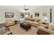 Bright living room featuring neutral decor and sliding doors to the yard at 26147 L And J Rd, Myakka City, FL 34251