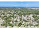 Panoramic aerial shot showcasing the neighborhood, nearby greenery, and the home's proximity to water at 2866 E Rainbow Cir, Sarasota, FL 34231