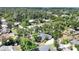 Expansive aerial view of property showing the home's layout, generous lot size, and mature trees at 2866 E Rainbow Cir, Sarasota, FL 34231