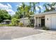 Charming single-story home with mature landscaping and a welcoming entrance, located in a desirable neighborhood at 2866 E Rainbow Cir, Sarasota, FL 34231