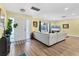 Inviting living room with hardwood floors, ample natural light, and a cozy atmosphere for relaxation at 2866 E Rainbow Cir, Sarasota, FL 34231