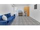 Stylish living space with unique tile flooring, comfortable seating, and a view of the bathroom at 2866 E Rainbow Cir, Sarasota, FL 34231