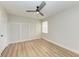 Spacious bedroom featuring a ceiling fan, wood-look floors, and neutral paint at 3005 Chianti Ct # 103, Sarasota, FL 34237