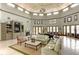 Spacious clubhouse area with fireplace, multiple seating areas and large windows at 3005 Chianti Ct # 103, Sarasota, FL 34237