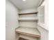 Desk area with white counters, wood trim, white walls and open shutter feature at 3005 Chianti Ct # 103, Sarasota, FL 34237