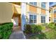 Well-maintained exterior entrance, vibrant landscaping, and convenient access to units at 3005 Chianti Ct # 103, Sarasota, FL 34237