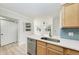 Bright kitchen featuring stainless steel appliances, light wood cabinets, and an eat-in area at 3005 Chianti Ct # 103, Sarasota, FL 34237