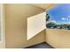 Private patio view overlooking the parking area and trees at 3005 Chianti Ct # 103, Sarasota, FL 34237