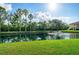 Picturesque water view with a fountain surrounded by lush landscaping at 3005 Chianti Ct # 103, Sarasota, FL 34237