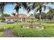 Landscaped fountain situated in front of the community clubhouse entrance at 3005 Chianti Ct # 103, Sarasota, FL 34237