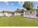 Backyard view with shed and grass at 3211 Deerfield Dr, Tampa, FL 33619