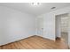 This bedroom features hardwood floors, a closet, and neutral walls at 3211 Deerfield Dr, Tampa, FL 33619
