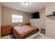 Bedroom with flat screen television, ceiling fan, and dark-colored bedspread at 3211 Deerfield Dr, Tampa, FL 33619