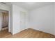 This bedroom features hardwood floors, a closet, and neutral walls at 3211 Deerfield Dr, Tampa, FL 33619