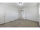 Large bedroom ready for renovation with exposed baseboards, new paint and modern lighting at 3211 Deerfield Dr, Tampa, FL 33619