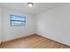 This bedroom features hardwood floors, natural lighting, and neutral walls at 3211 Deerfield Dr, Tampa, FL 33619
